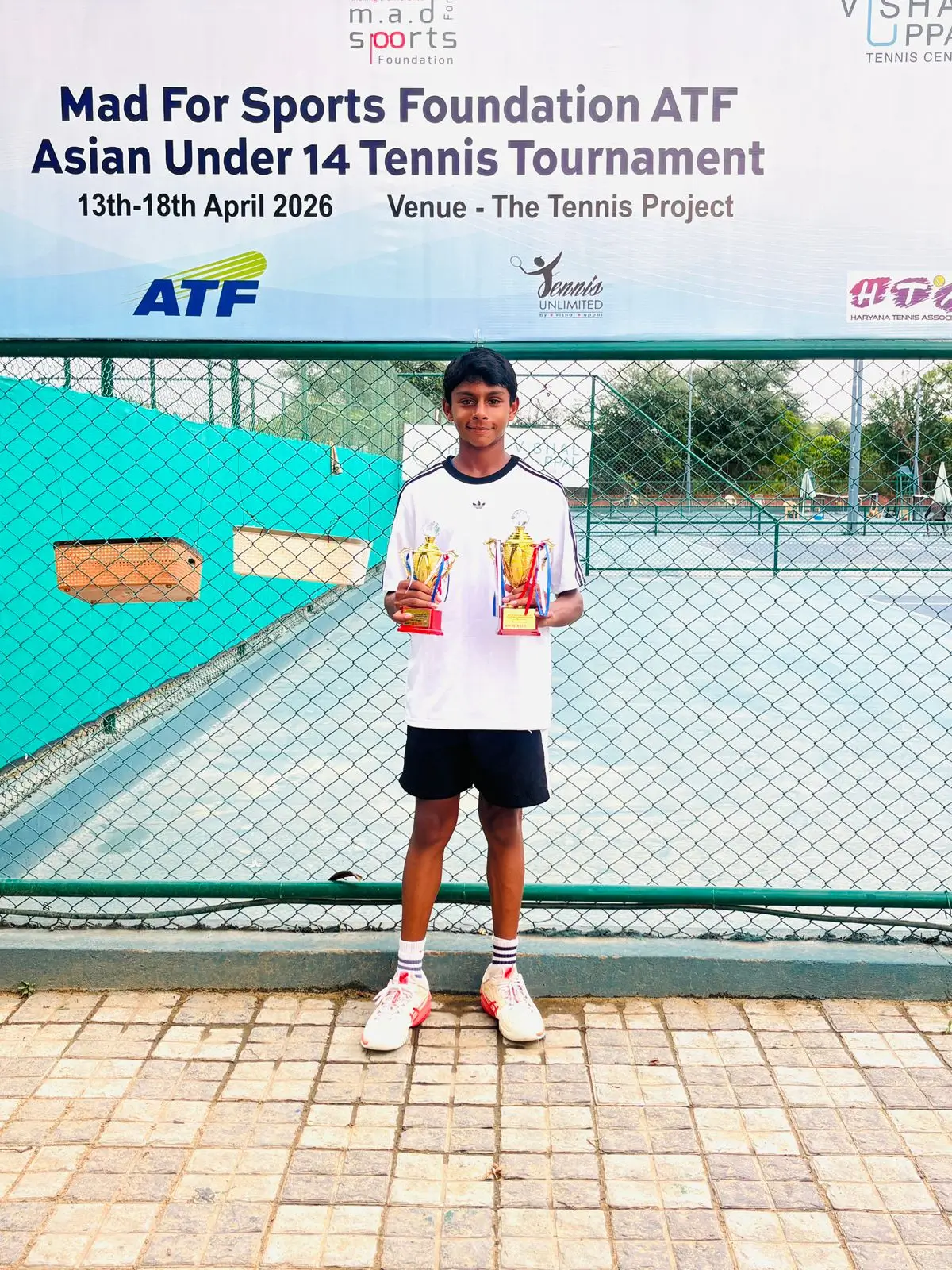 Sparsh receiving trophy for winning the Asian Gurgaon U-14 Tennis Tournament