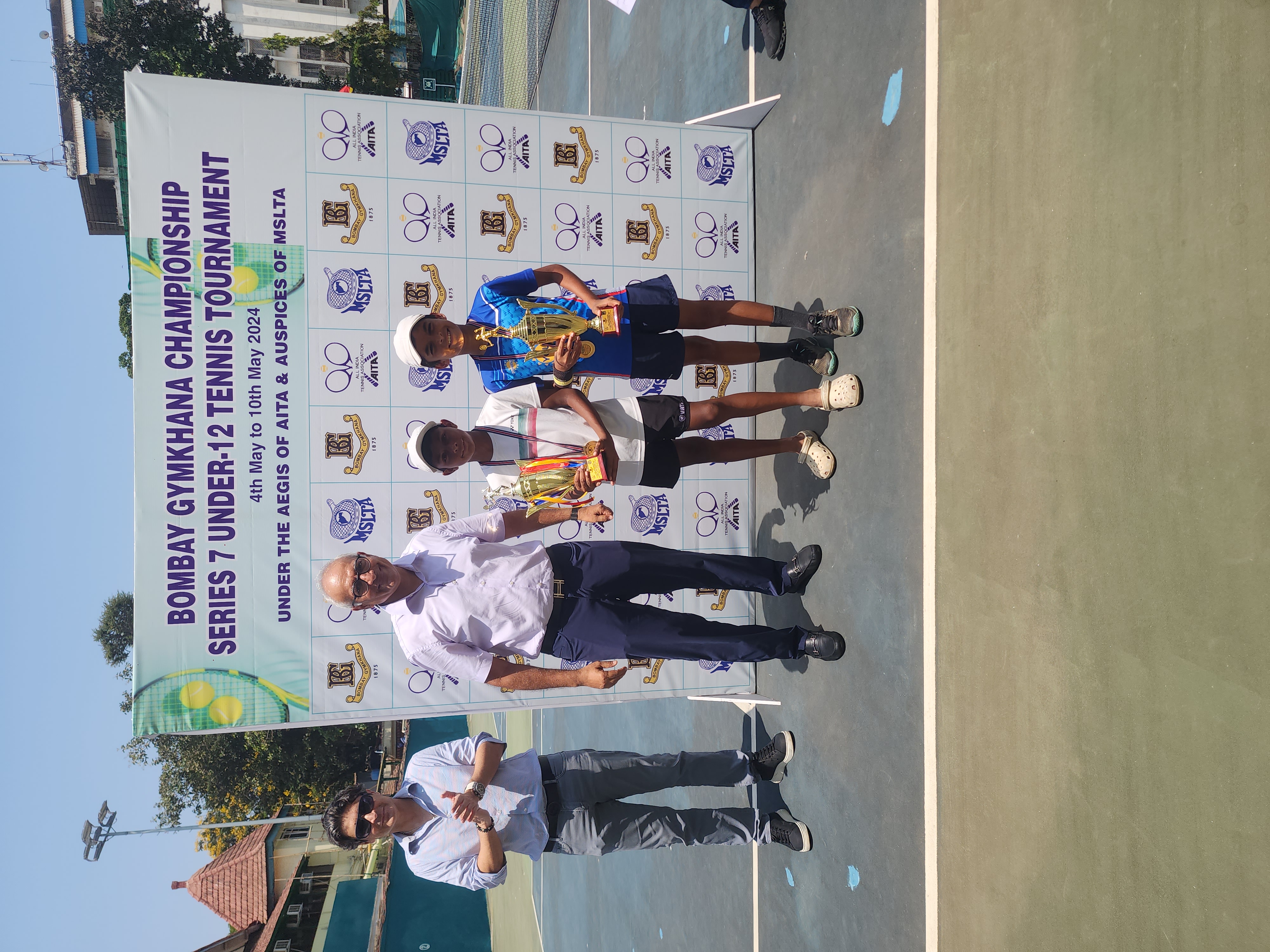 Sparsh receiving trophy for winning the singles and doubles at the Under 12 Championship Series (CS7) 2024 - Bombay Gymkhana