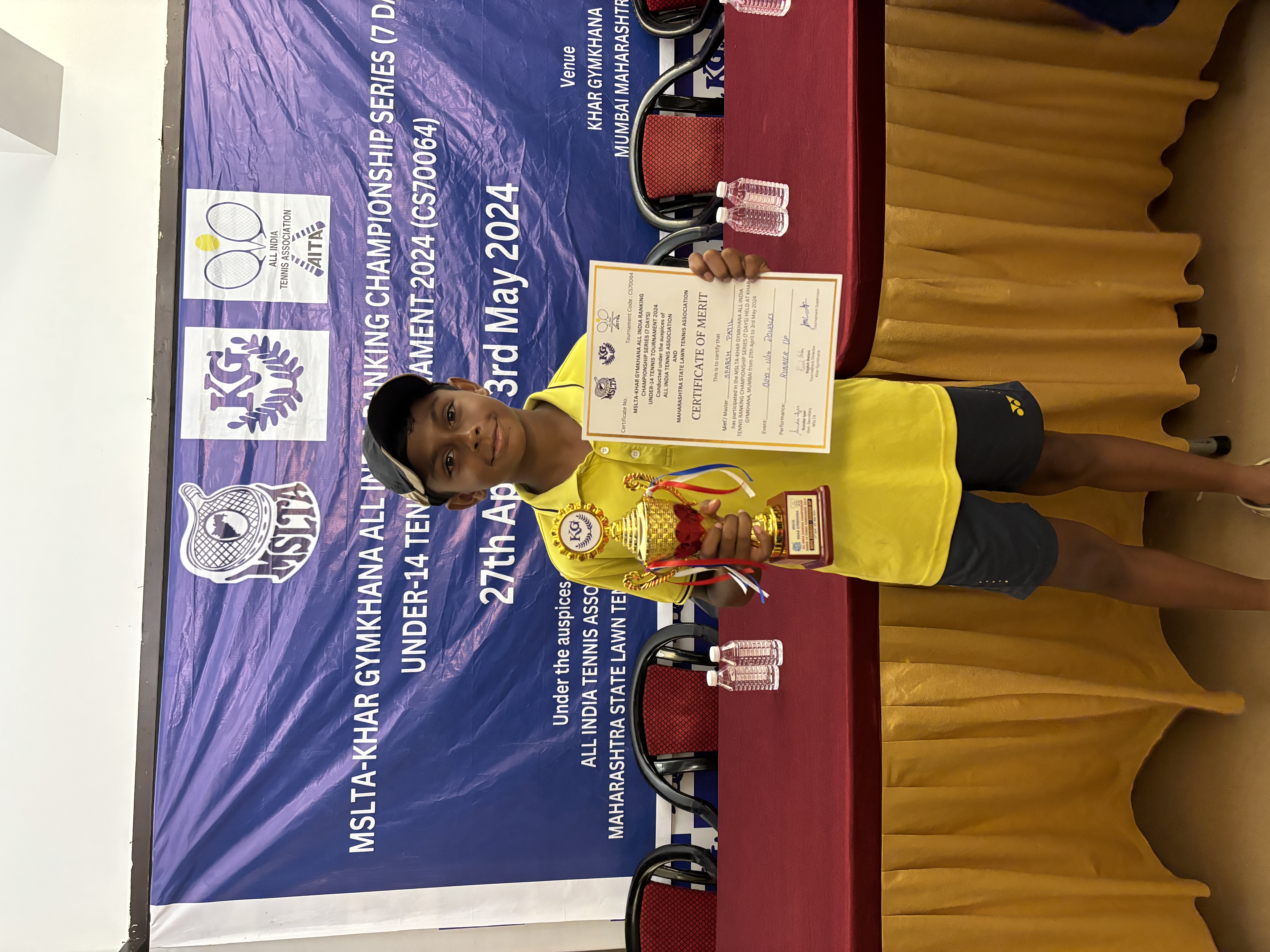 Sparsh collecting trophy for runner up in doubles category at the Under 14 Championship Series (CS7) 2024 - Khar Gymkhana