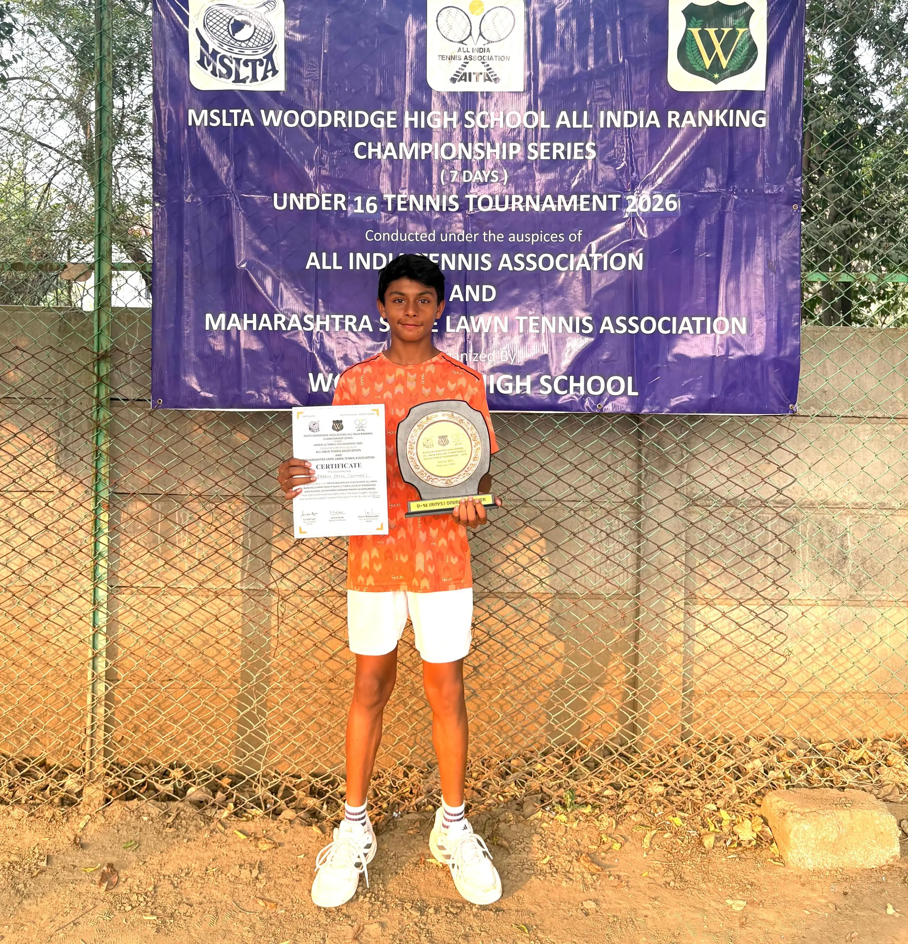 Sparsh receiving trophy for winning doubles and runner up in singles at the MSLTA Woodridge High School All India Championship Series Under 16